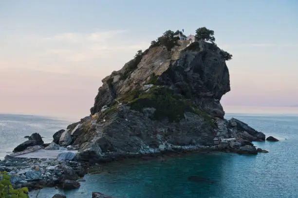 The church of Agios Ioannis Kastri on a rock at sunset, famous from Mamma Mia movie scenes, Skopelos Island, Greece
