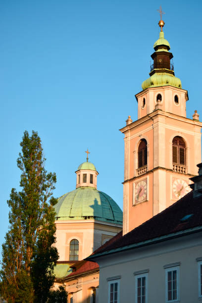 istock Church with clock at sunset. Slovenia 1077297618