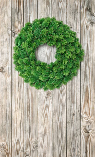 istock Christmas wreath decoration wooden background 1077299080