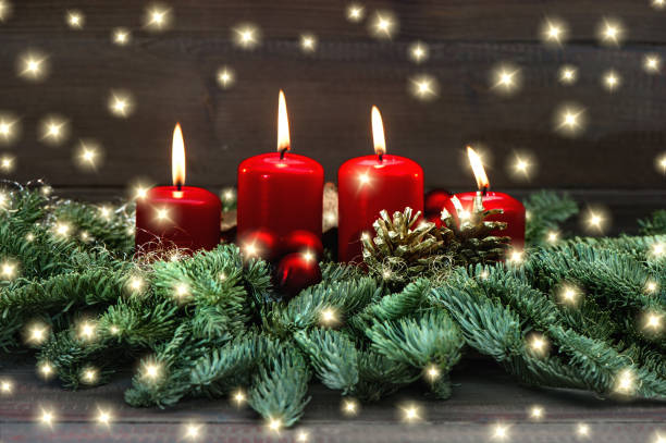 istock Advent decoration wreath four red burning candles lights 1077299850