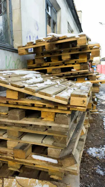 Wooden pallets, dirty old transport pallets outdoor.