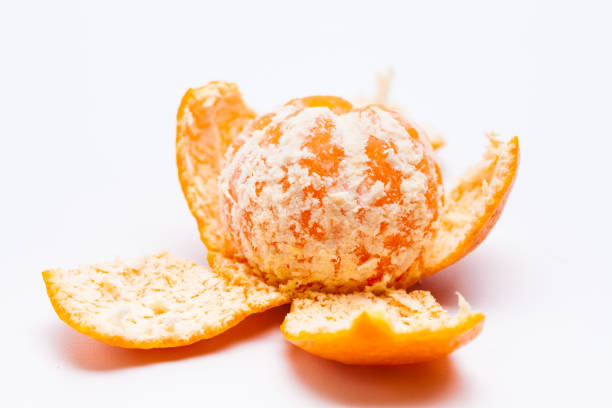 istock Peeled mandarin oranges on white background 1077309284