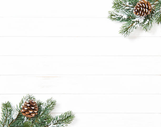 istock Christmas tree branches bright wooden background Winter 1077311588