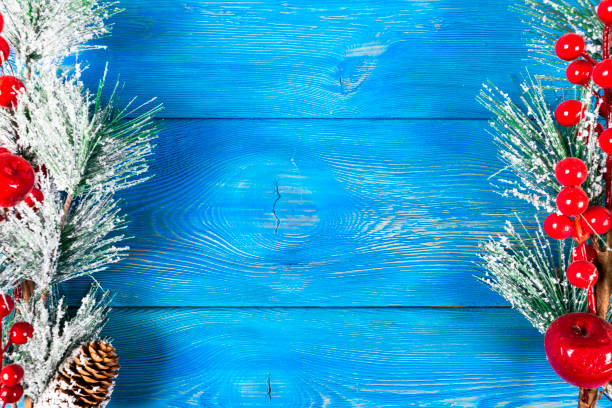istock Christmas concept. Christmas fir tree with decoration on rustic vintage board. Pine branches. Fir cones. Snow on wood. Xmas and Happy New Year composition. Copy space. Empty space. Top view. Christmas background 1077312106