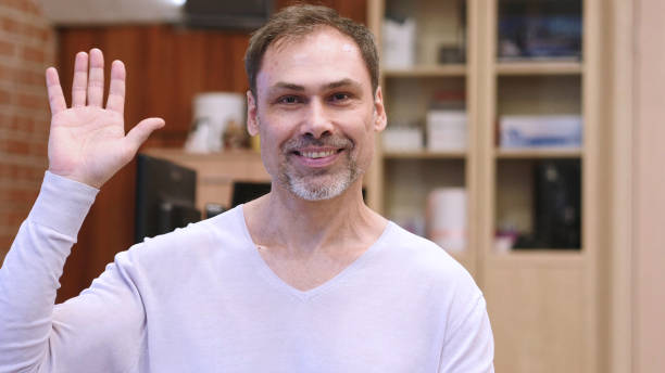istock Hello Gesture by Middle Age Man in Office 1077312450