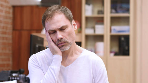 istock Sleeping Tired Middle Age Man at Work, Portrait Indoor 1077312640
