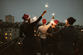 friends celebrate the christmas on the rooftop