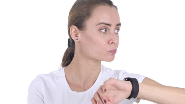 istock Middle Aged Woman Waiting and Watching Time, White Background 1077315634