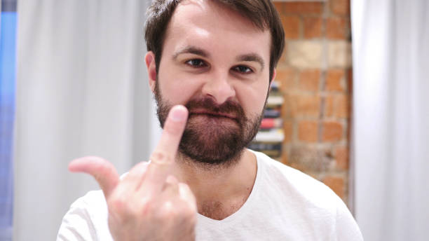 istock Serious Beard Man Showing Middle Finger in Anger 1077317856