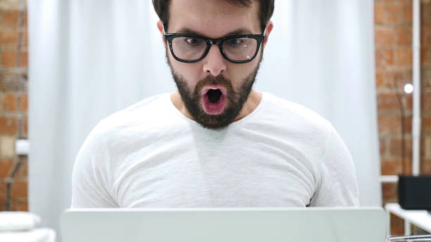 istock Shocked Man at Work, Amazed by Surprise 1077318268