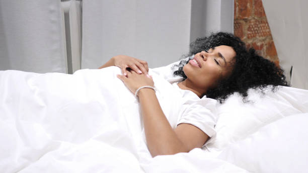 istock Afro-American Woman  Lying in Bed 1077318330