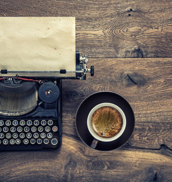 istock Vintage typewriter grungy paper black coffee 1077318368