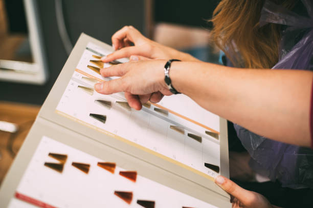 istock Women hands with a dye color catalog 1077319408