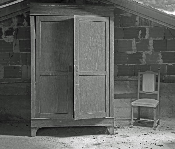 istock abandoned wooden wardrobe and a chair 1077319824