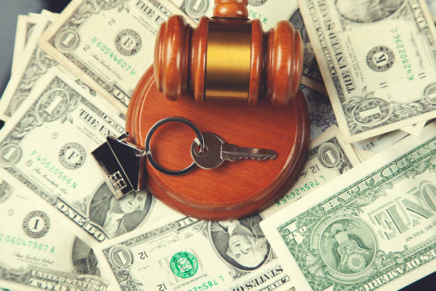 istock judge on money with key 1077328078
