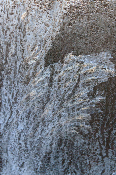 istock Frosty patterns on a frozen ice box in the early morning 1077329382