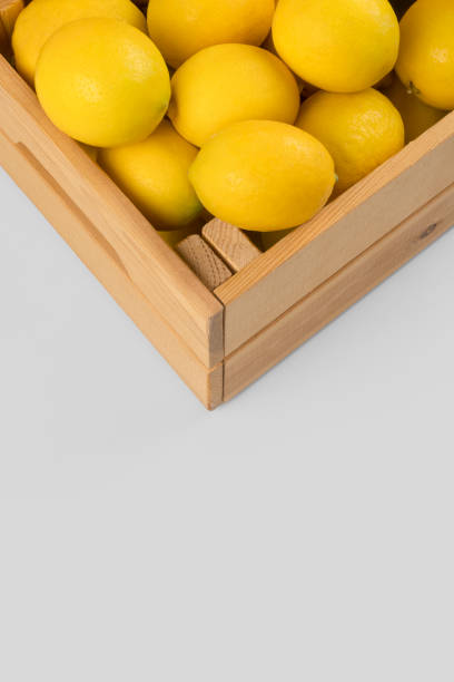 istock Fresh lemons in a wooden crate 1077335724
