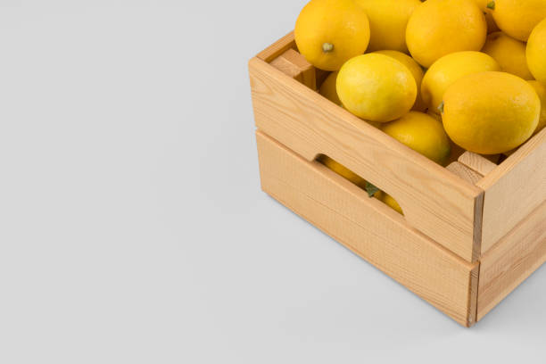 istock Fresh lemons in a wooden crate 1077336530