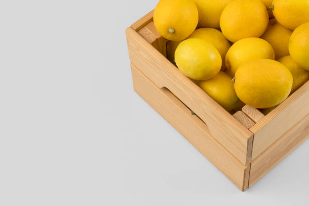 istock Fresh lemons in a wooden crate 1077336856
