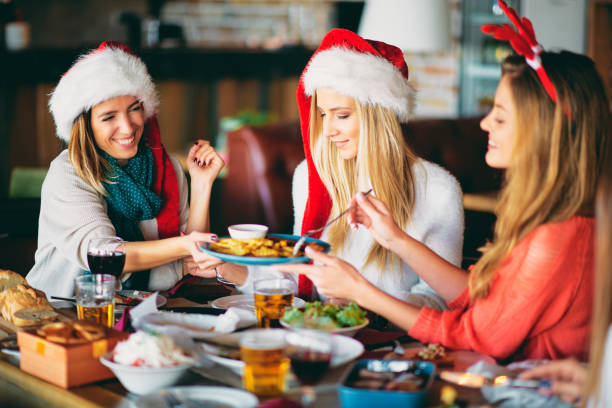istock Friends having dinner at home at Christmas eve. 1077337390