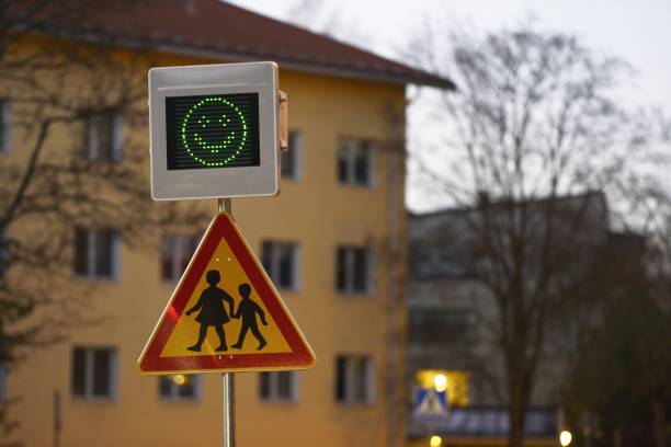road sign school and speed control with a smiley stock photo