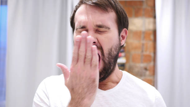 istock Tired Beard Man Yawning in Office, Indoor 1077356438