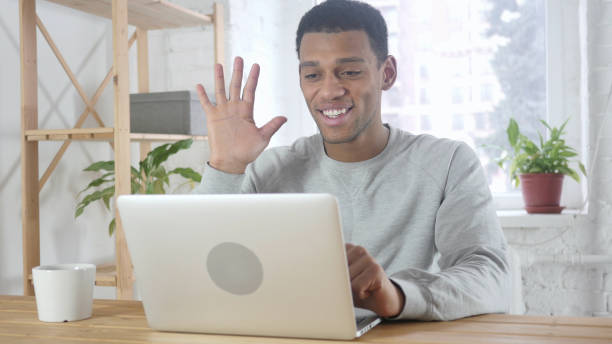 istock Video Chat by Young Afro-American Man in Office on Laptop 1077357682