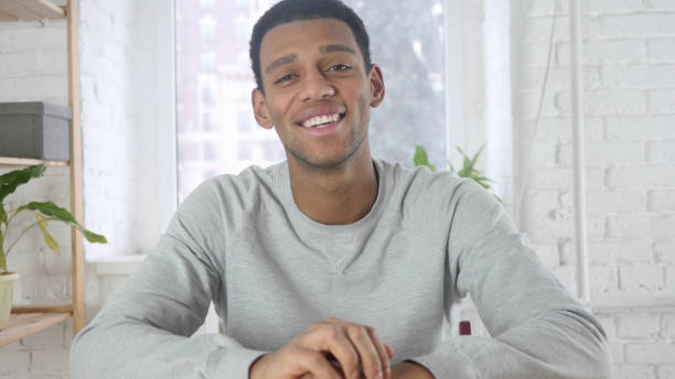 istock Video Chat at Work, Afro-American Man Talking with Customers 1077357966