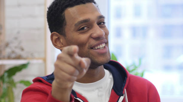 istock Afro-American Man Pointing at Camera in Office 1077358326