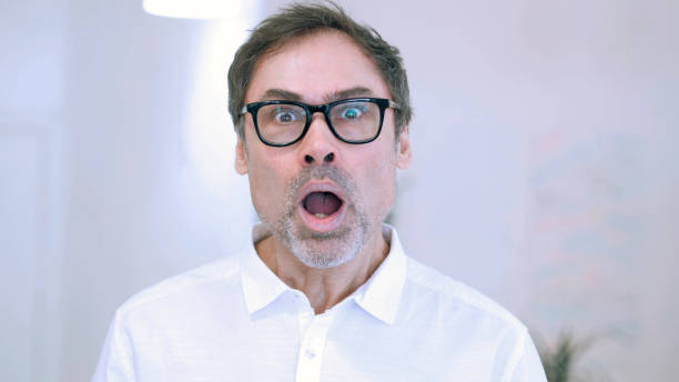istock Portrait of Middle Aged Man in Shock, Wondering 1077358926