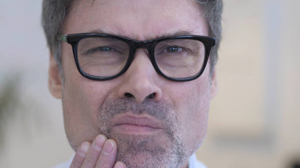 istock Toothache, Close up of Middle Aged Man with Tooth Infection 1077359130