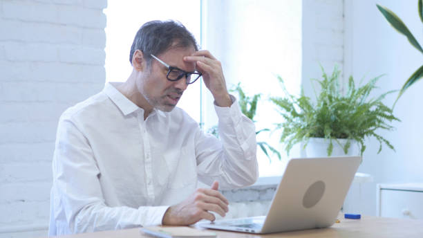 istock Loss, Frustrated Middle Aged Man Working on Laptop 1077359160