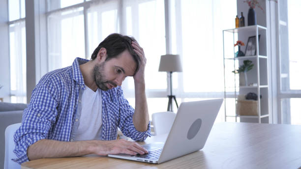istock Loss, Frustrated Casual Beard Man Working on Laptop 1077359946
