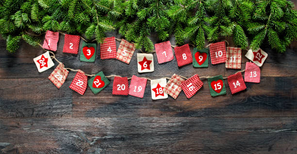 istock Advent calendar Christmas tree branches wooden background 1077360650