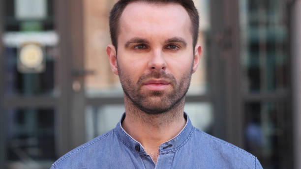 istock Serious Casual Man Looking at Camera 1077360990