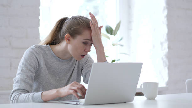 istock Loss, Frustrated Young Woman Working on Laptop 1077361028