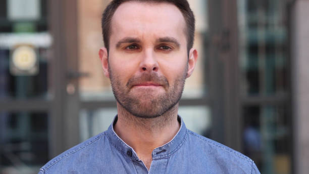 istock Upset Sad Casual Man Looking at Camera 1077361040