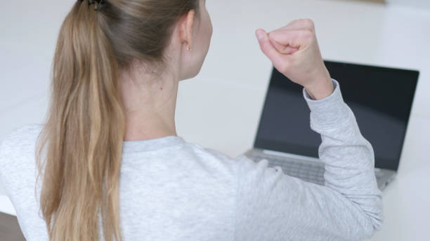 istock Winning Young Woman Celebrating  Success 1077362498