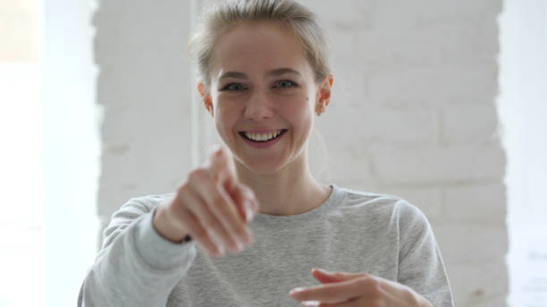 istock Woman Pointing with Finger 1077362898