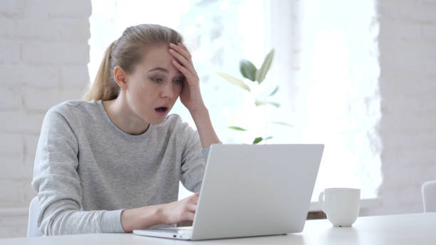 istock Upset Angry Young Woman Working on Laptop in Office 1077363730