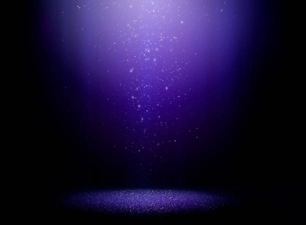 Magic night Stage with one light beam and sparkly dust falling from above stage light stock pictures, royalty-free photos & images