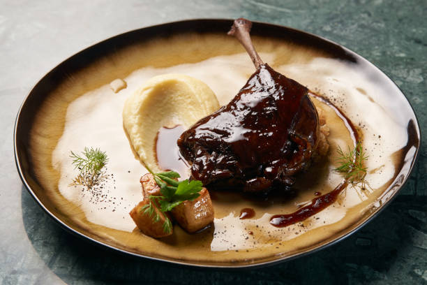 istock Baked Duck drumstick with Quinoa puree, celery, apple 1077380050