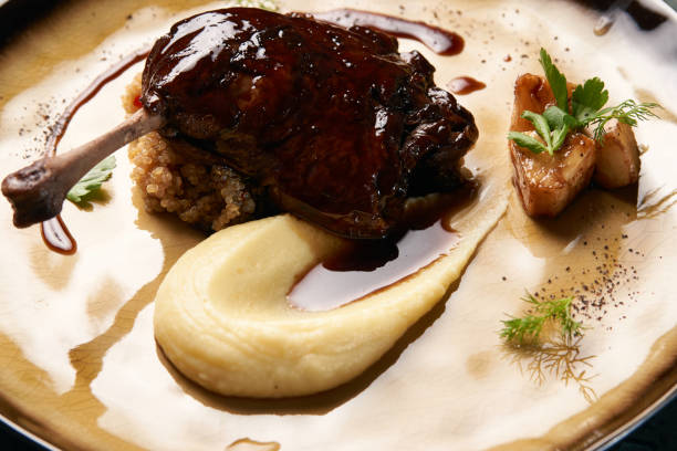 istock Baked Duck drumstick with Quinoa puree, celery, apple 1077380104