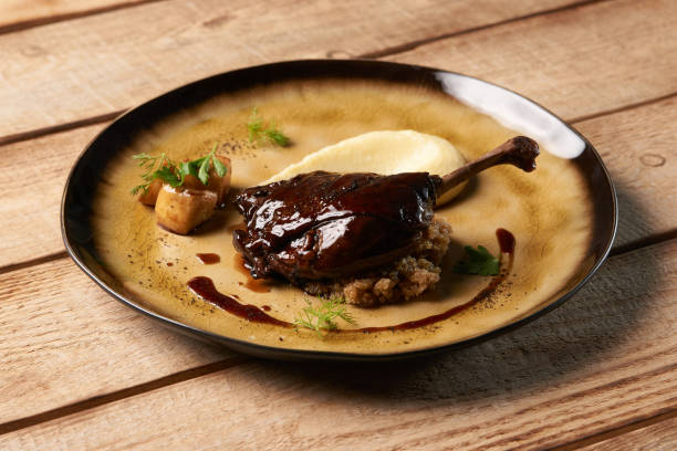 istock Roasted Duck drumstick with Quinoa puree, celery, apple 1077380120