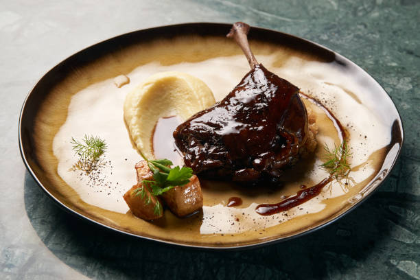 istock Baked Duck drumstick with Quinoa puree, celery, apple 1077380128