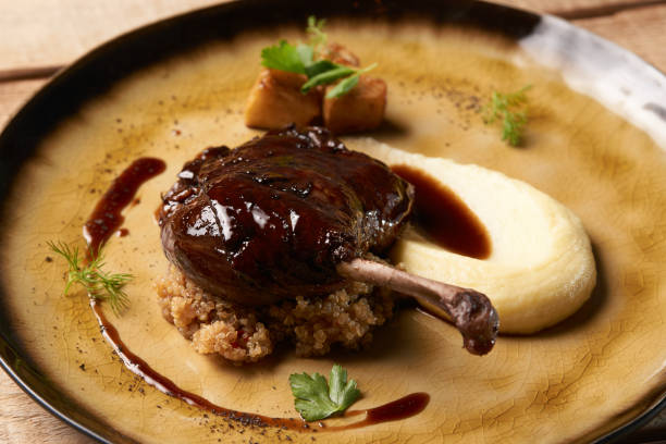 istock Roasted Duck drumstick with Quinoa puree, celery, apple 1077380140