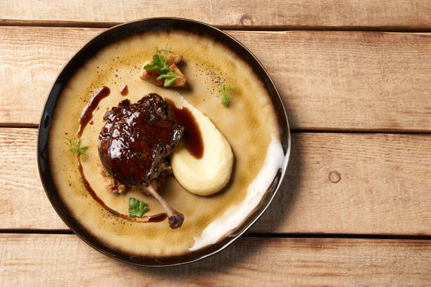 istock Roasted Duck drumstick with Quinoa puree, celery, apple 1077380172