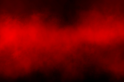 Red smoke over black background