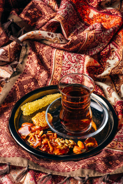 istock Tea in armudu with oriental delights and crystal sugar 1077388636