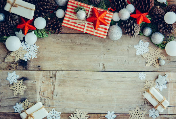 istock Christmas background with gift boxes and decorations on the wood 1077393770